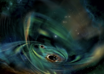 Captan por primera vez la señal de un sistema binario de agujeros negros masivos interactuando con una nube de gas